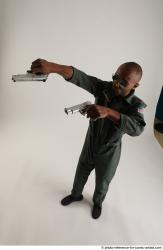 ERIC STANDING POSE WITH GUNS